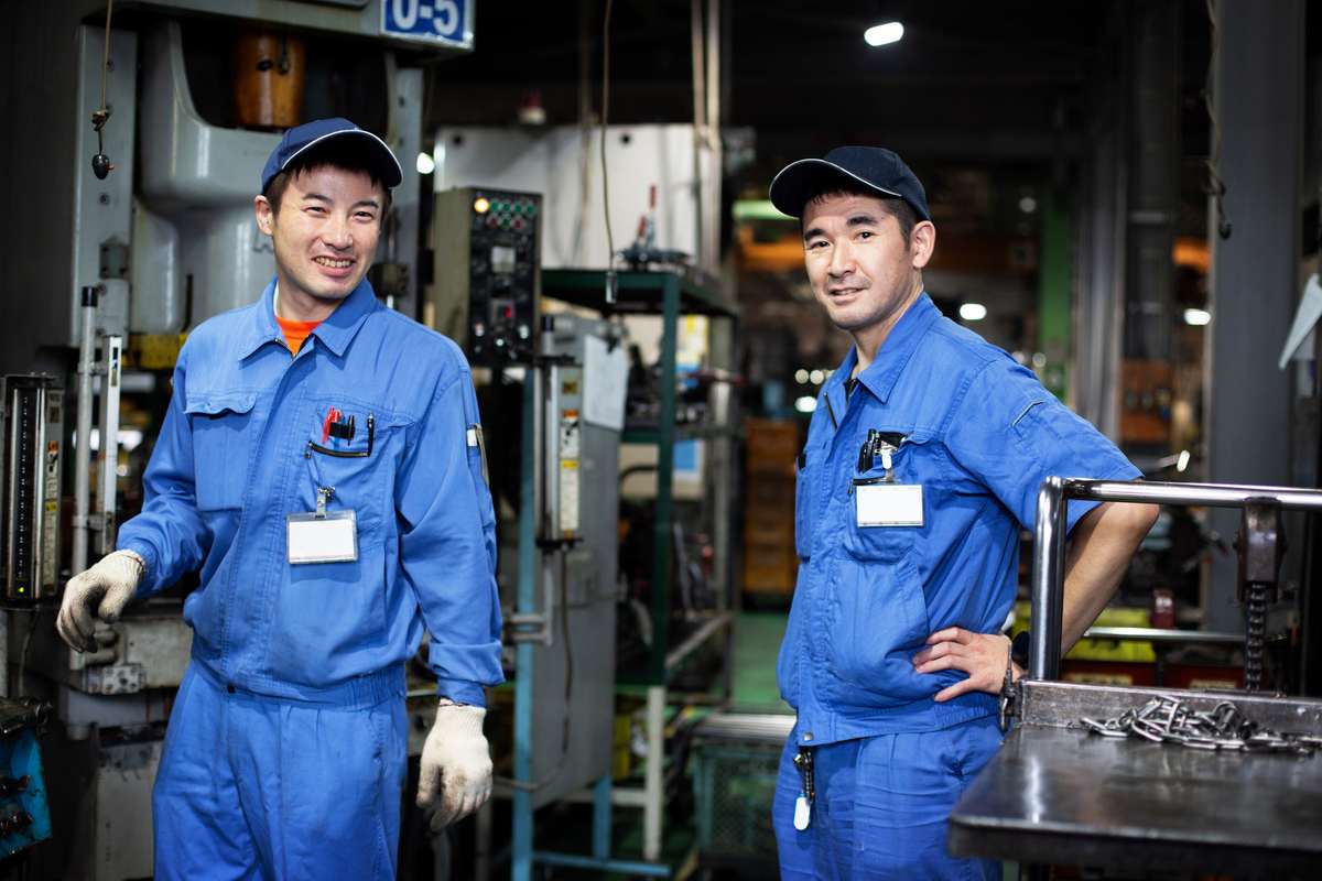 two-japanese-men-wearing-baseball-caps-and-blue-ov-2021-08-28-17-41-31-utc